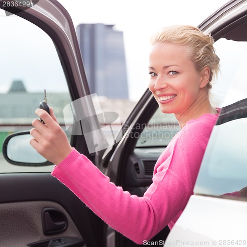 Image of Woman driver showing car keys.