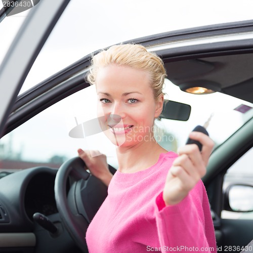 Image of Woman driver showing car keys.