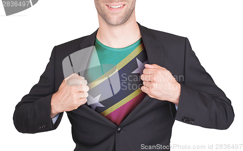 Image of Businessman opening suit to reveal shirt with flag