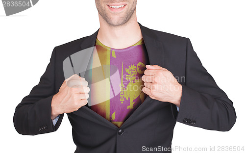 Image of Businessman opening suit to reveal shirt with flag