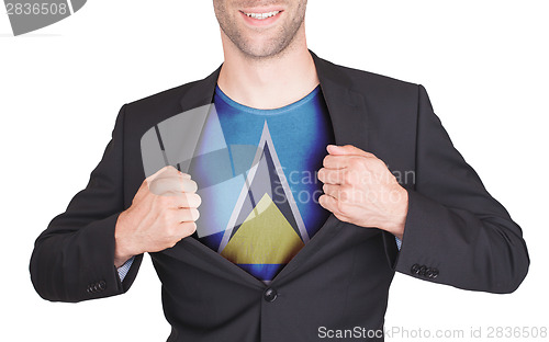 Image of Businessman opening suit to reveal shirt with flag