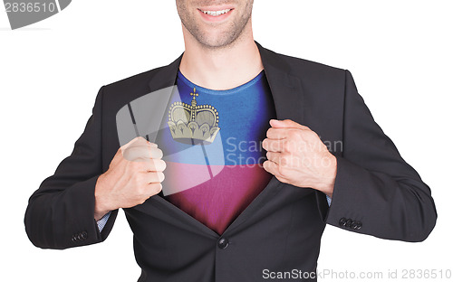 Image of Businessman opening suit to reveal shirt with flag