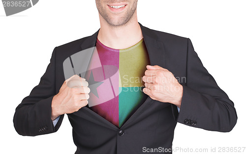 Image of Businessman opening suit to reveal shirt with flag