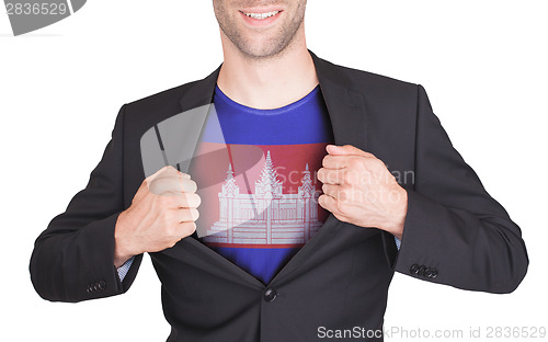 Image of Businessman opening suit to reveal shirt with flag