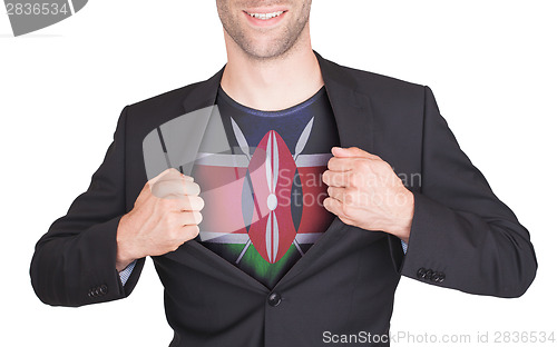 Image of Businessman opening suit to reveal shirt with flag