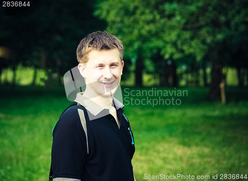 Image of Headshot Of A Young Man Smiling At Camera In Park