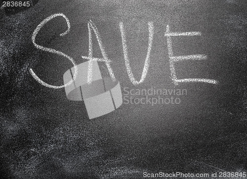 Image of Handwritten message on chalkboard writing message Save