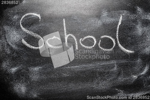 Image of Handwritten message on chalkboard writing message School