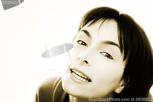 Image of Young woman in bed