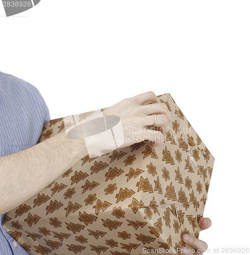 Image of Young man holding a present