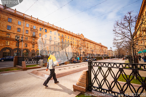 Image of Man walking on the sidewalk in Minsk, Belarus