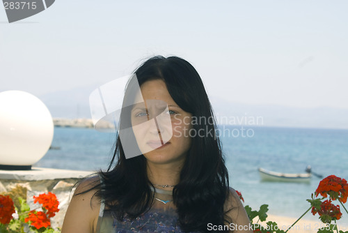 Image of attractive young woman in cafe