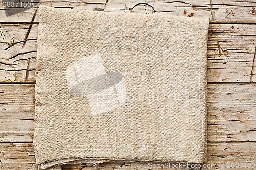 Image of cotton napkin on old wooden table