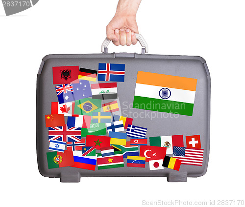 Image of Used plastic suitcase with stickers