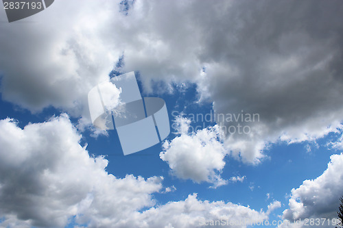 Image of picturesque white clouds on blue sky background
