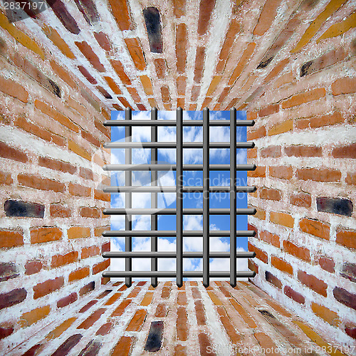 Image of Prison's window and bars in wall from brick