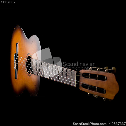 Image of Girl playing a guitar