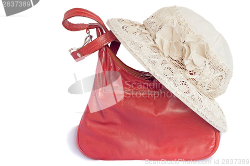 Image of Female summer hat for protection against the sun and a bag on a 