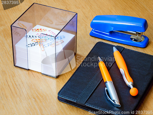 Image of Two beautiful handles for the letter, a stapler, the laptop and 
