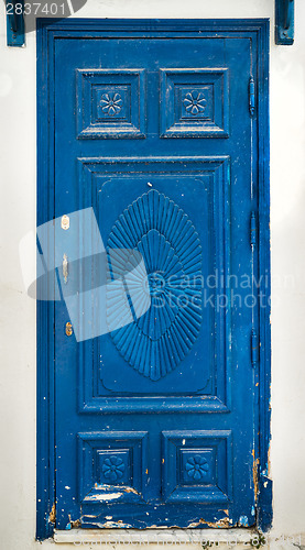 Image of Blue wooden door as symbol of Sidi Bou Said 