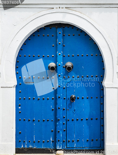 Image of Blue gate and door with ornament from Sidi Bou Said