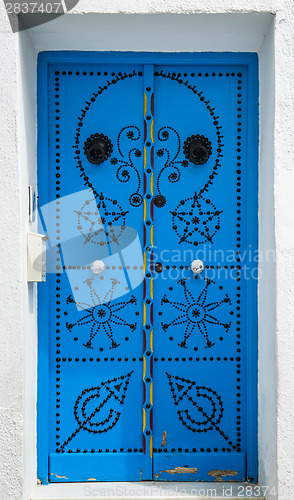 Image of Traditional blue door from Sidi Bou Said in Tunisia