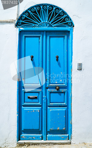 Image of Aged Blue door in Andalusian style from Sidi Bou Said