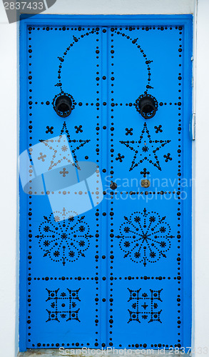 Image of Blue door with ornament from Sidi Bou Said in Tunisia