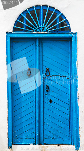 Image of Blue wooden door with arch from Sidi Bou Said