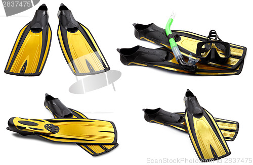 Image of Set of yellow swim fins, mask and snorkel for diving