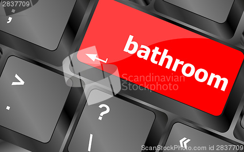 Image of bathroom word on keyboard key, notebook computer