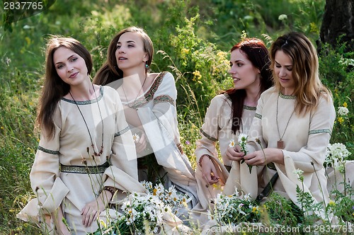 Image of Attractive women relaxing on nature