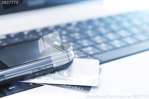 Image of Credit cards and mobile phone on the laptop