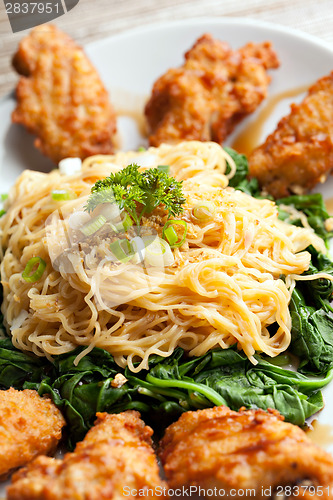 Image of Chicken Wings with Noodles and Spinach