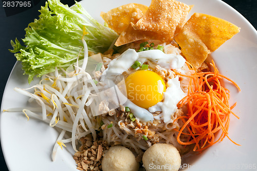 Image of Thai Noodle Dish with Fried Egg