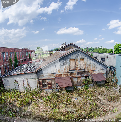 Image of old abandoned rusty and falling apart building