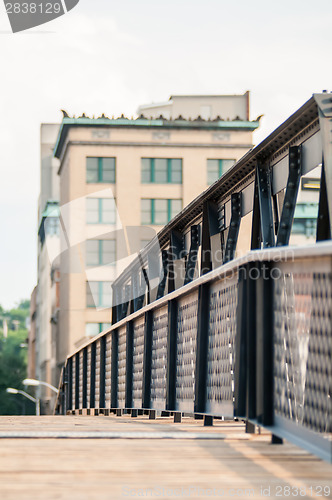 Image of small city bridge leading to the city