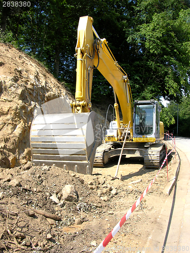 Image of Yellow digger working on a site