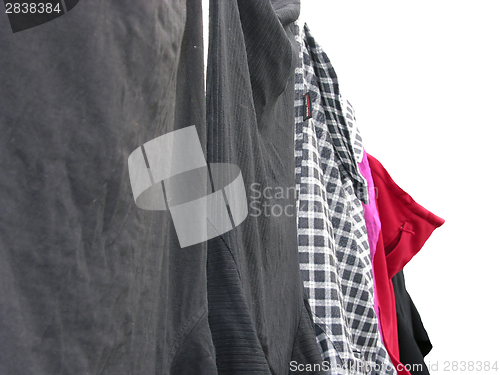 Image of Clothesline with some laundered clothes on white