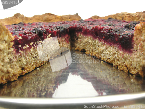 Image of Cutted berry cake on a cake tray