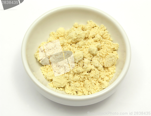 Image of Soy meal in a little white bowl of chinaware on white