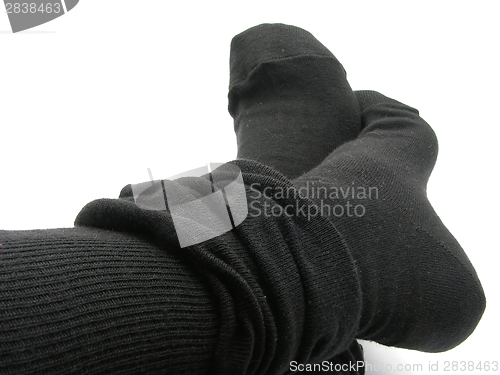 Image of Feet in black, plump and long stockings