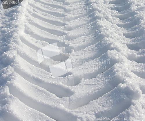 Image of The skidmark of a tractor in the snow