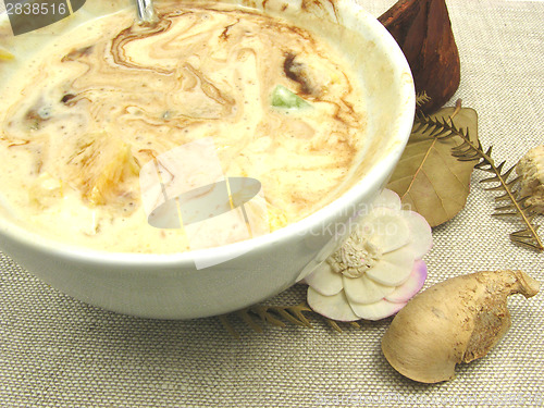 Image of Yogurt floured with chocolate in a bowl of chinaware and table d