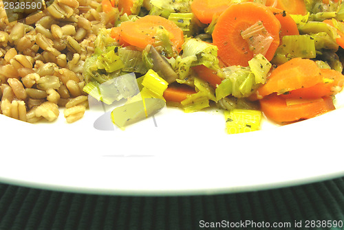 Image of Dish made of cooked bulgur wheat groats, carrots and leek