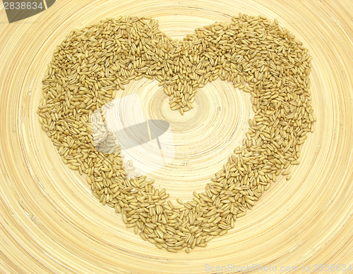 Image of Bamboo plate with heart out of grain 