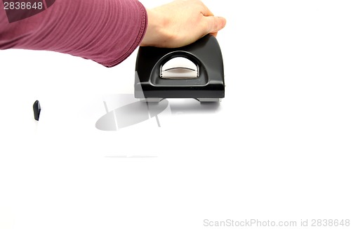 Image of Hand with hole punsh