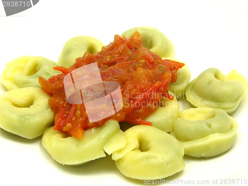 Image of Stuffed noodles with tomato sauce in a close-up view 