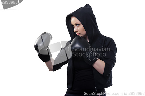 Image of Young woman in boxing gloves on a white background