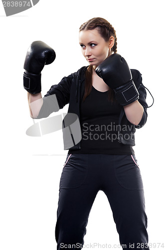 Image of Young woman in boxing gloves on a white background